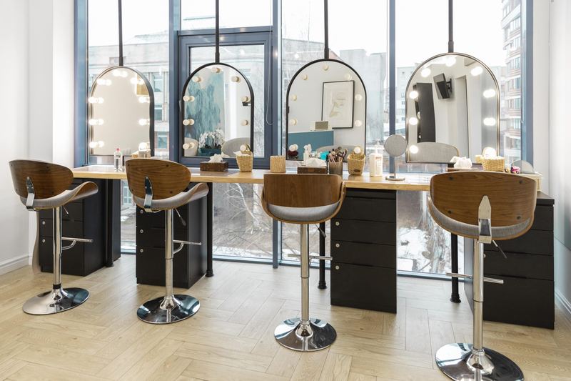 The Lioréa Lounge interior with styling stations, mirrors and warm lighting